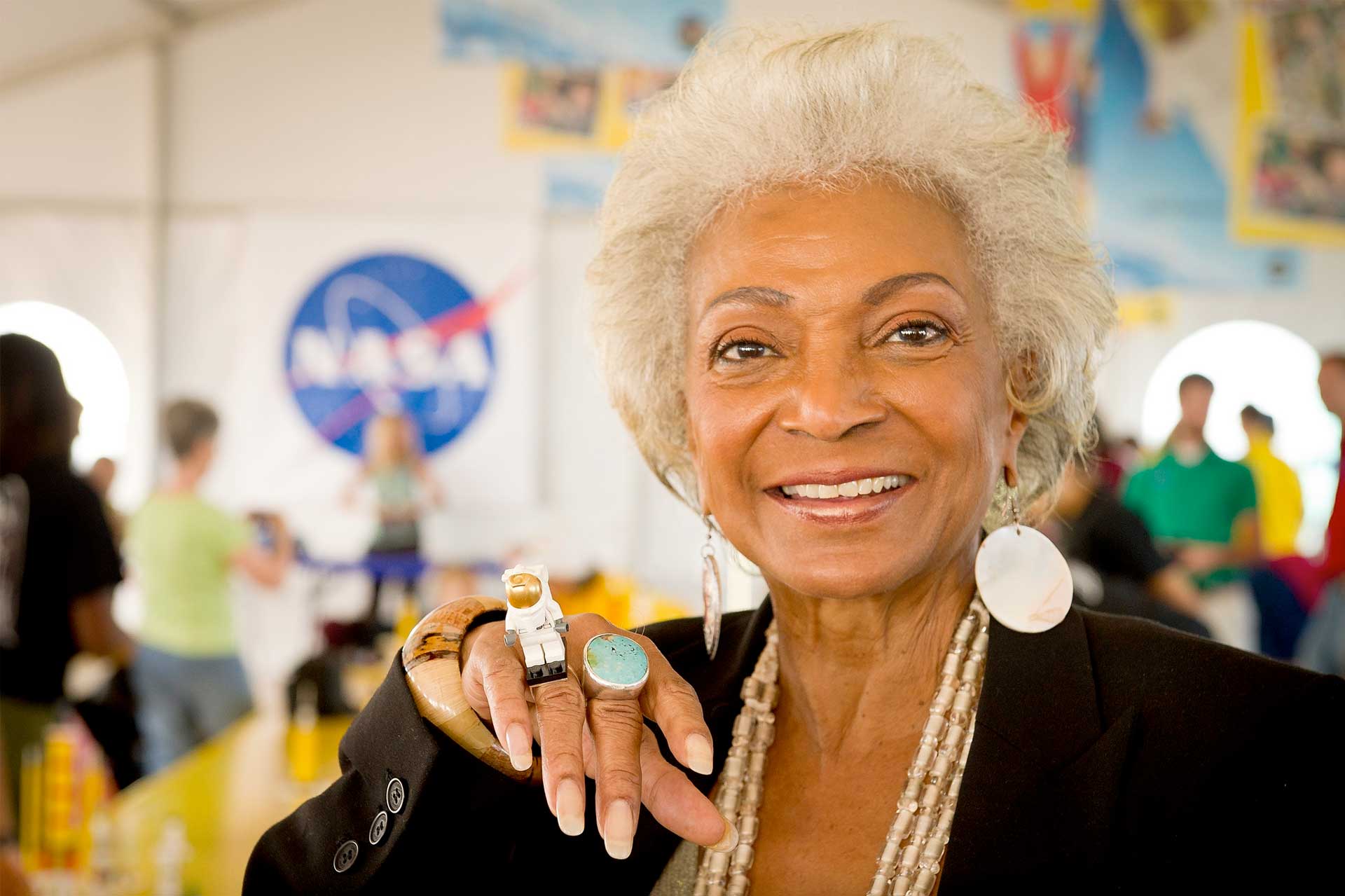 Actress Nichelle Nichols, known for her most famous role as communications officer Lieutenant Uhura aboard the USS Enterprise in the popular Star Trek television series, displays her Lego astronaut ring. Photo Credit: (NASA/Bill Ingalls)