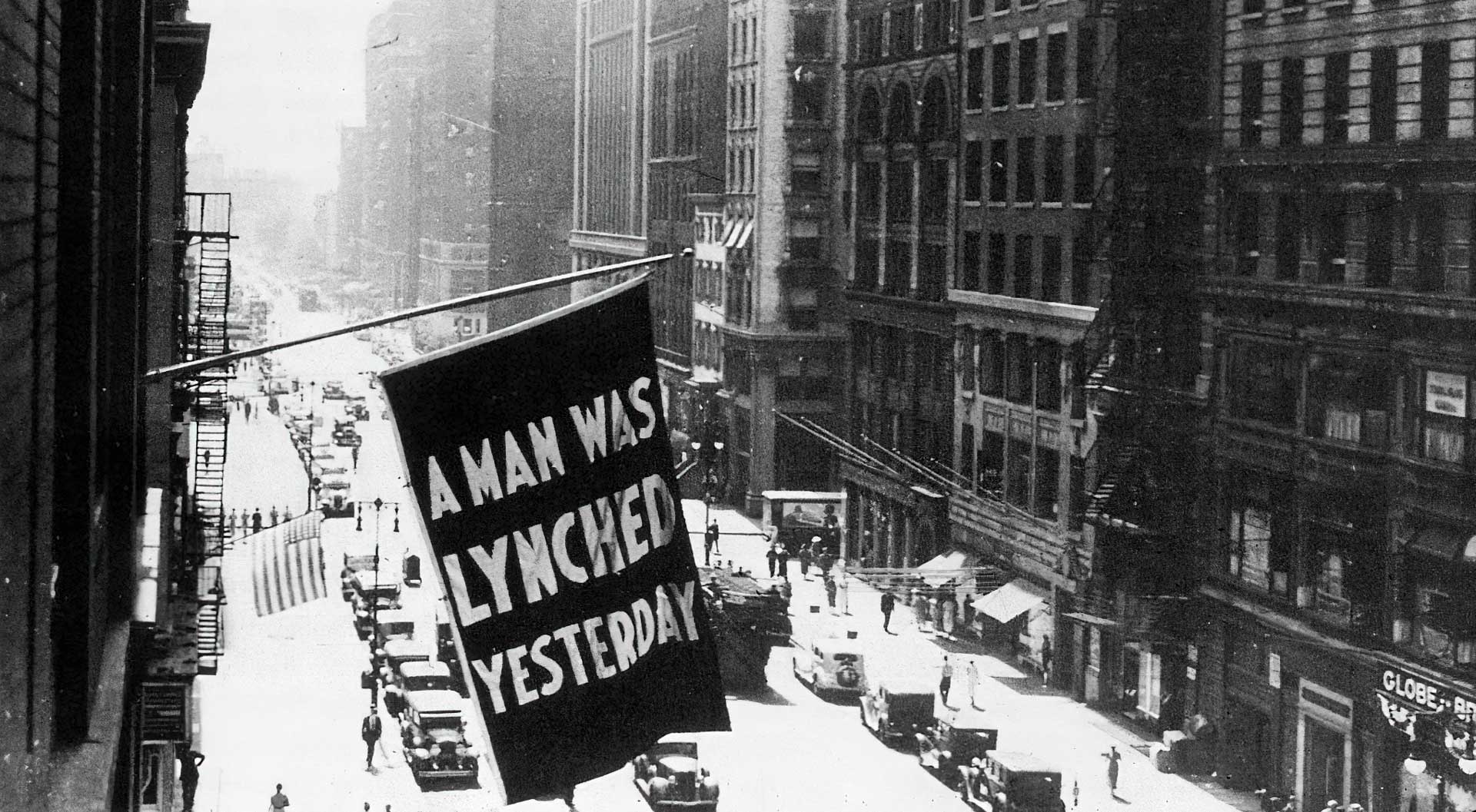 1936: A flag hanging outside the headquarters of the NAACP (National Association for the Advancement of Coloured People) at 69 Fifth Avenue, New York City, bearing the words “A Man was Lynched Yesterday.” (Photo by MPI/Getty Images)